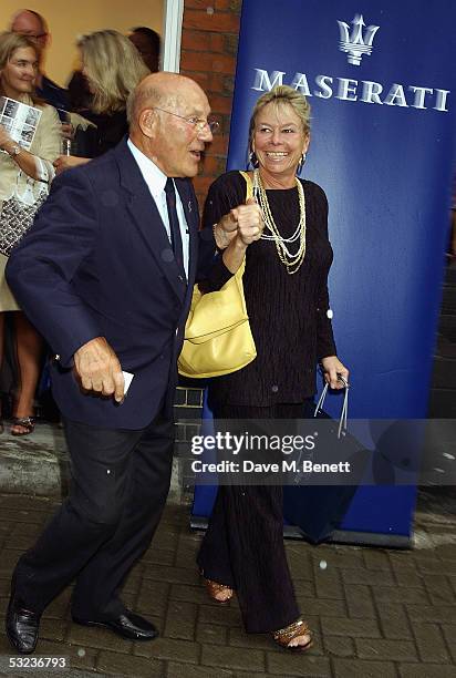 Stirling and Susie Moss attend an exhibition of Maserati Sports cars through the years hosted by Stephen Bayley at the Michael Hoppen Gallery on July...