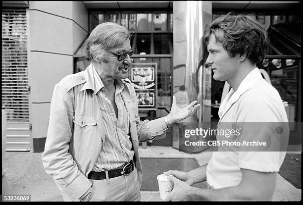 American writer and Marvel Comics founder Stan Lee gestures as he talks to actor Nicholas Hammond during the production of the television series 'The...