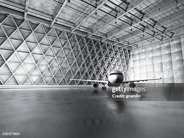 hangar, garage, warehouse with passenger airplane - hangar stockfoto's en -beelden