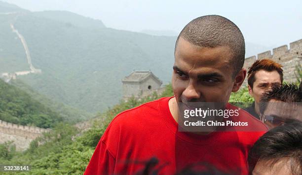 Basketball player Tony Parker visits the Great Wall on July 14, 2005 in Beijing, China. Parker is in Beijing to attend the "Basketball without...