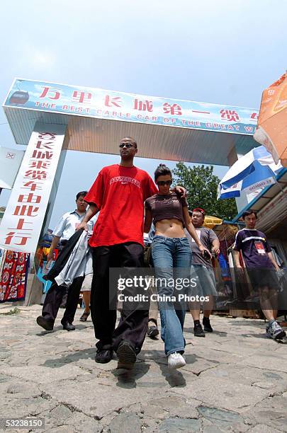 Basketball player Tony Parker of the San Antonio Spurs and his girl friend visit the Great Wall on July 14, 2005 in Beijing, China. Parker is in...
