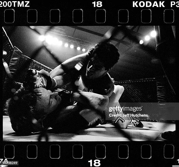 David Mitchell and Adrian Garcia go toe to toe during their mixed martial arts fight in the Gladiator Challenge cage at Colusa Casino on June 2, 2004...
