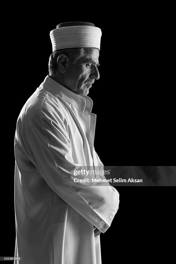 Muslim imam praying,black and white portrait