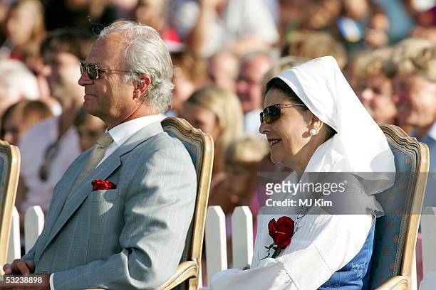 King Carl Gustav and Queen Sylvia are seen at a concert during celebrations for Crown Princess Victoria's 28th birthday on July 14, 2005 in Borgholm,...