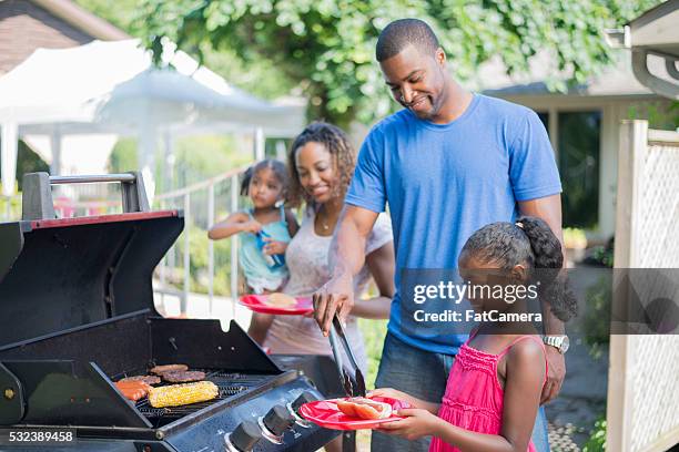 family barbecue on father's day - summer grilling stock pictures, royalty-free photos & images