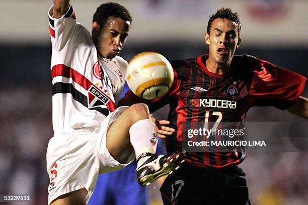 Sao Paulo's Junior fights for the ball with Atletico Paranaense's Andre Rocha, during the Libertadores Cup final, held at the Morumbi stadium, in Sao...