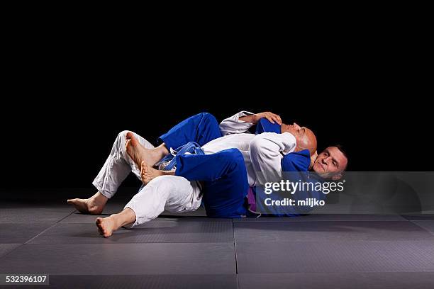 brazilian jiu-jitsu martial arts - jujitsu stock pictures, royalty-free photos & images