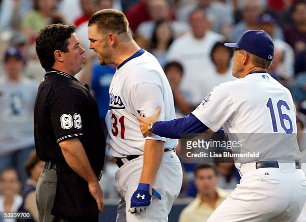 Pitcher Brad Penny of the Los Angeles Dodgers is ejected from the game by umpire Rob Drake in the 3rd inning against the San Francisco Giants while...