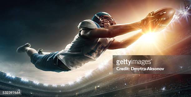 american football player jumping - touchdown stock pictures, royalty-free photos & images