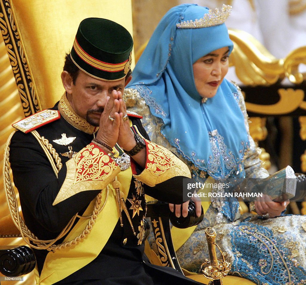 Bruneian Sultan Hassanal Bolkiah (L) gre