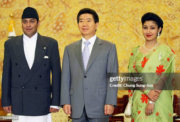 South Korean President Roh Moo-Hyun poses with Nepalese Crown Prince Paras Bir Bikram Shah Dev and Crown Princess Himani Rajya Laxmi Devi Shah at the...