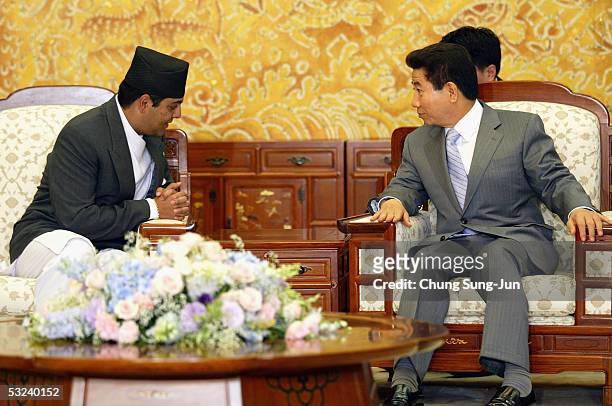 Nepalese Crown Prince Paras Bir Bikram Shah Dev talks with South Korean President Roh Moo-Hyun at the presidential house on July 15, 2005 in Seoul,...