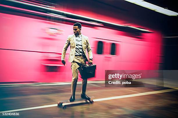 businessman in hurry on longboard - youth culture speed stock pictures, royalty-free photos & images