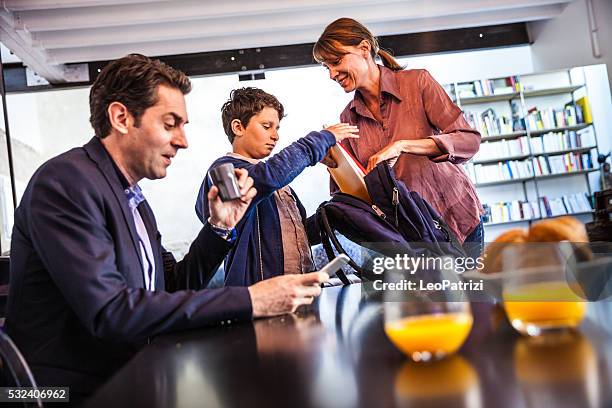 french family in the morning prep for school and breakfast - prep school stockfoto's en -beelden