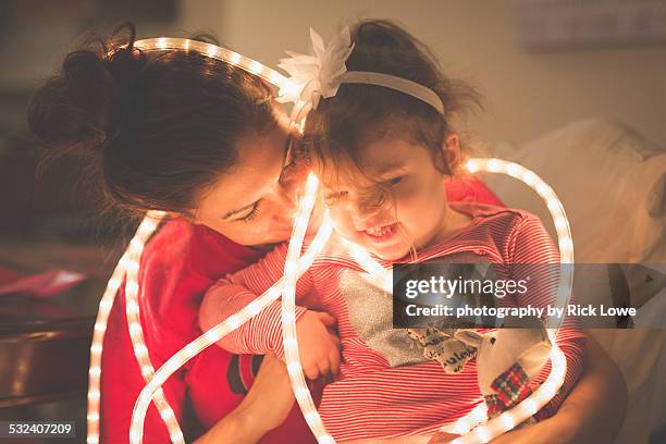 mother daughter lovable moment - xmas together stock-fotos und bilder