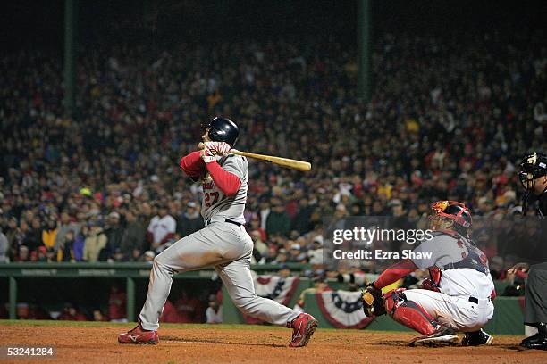 Scott Rolen of the St. Louis Cardinals bats against the Boston Red Sox during game two of the 2004 World Series on October 24, 2004 at Fenway Park in...