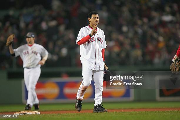 Orlando Cabrera of the Boston Red Sox holds up two fingers signifying his team's 2-0 series lead against the St. Louis Cardinals following game two...