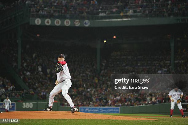 Curt Schilling of the Boston Red Sox pitches against the St. Louis Cardinals during game two of the 2004 World Series on October 24, 2004 at Fenway...