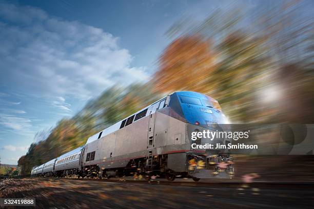 speeding train traveling - train vehicle stock pictures, royalty-free photos & images