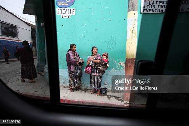 Mayans sell clothing on the streets of Antigua Guatemala. Mayans are preparing to welcome the 13th Baktun, an end to the ancient mayan calendar on...