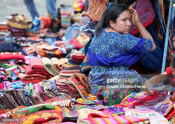 Mayans sell clothing on the streets of Antigua Guatemala. Mayans are preparing to welcome the 13th Baktun, an end to the ancient mayan calendar on...