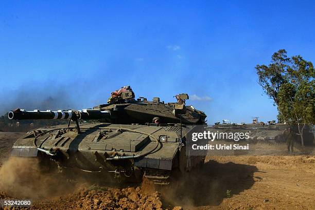 Tanks are parked in an army concentration area opposite to Jebalya refugee camp outside the Gaza Strip on July 15, 2005. Israeli helicopters pounded...