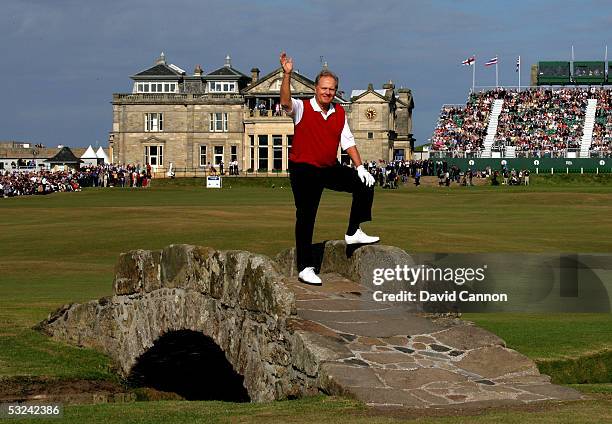 Jack Nicklaus of the USA waves to the crowd as he stands on the Swilcan bridge at what could be his last British Open during the second round of the...