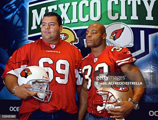 Cardinals player Rolando Cantu and Tony Parrish of San Francisco 49ers, pose for photographers during a press conference in Mexico City, 15 July...