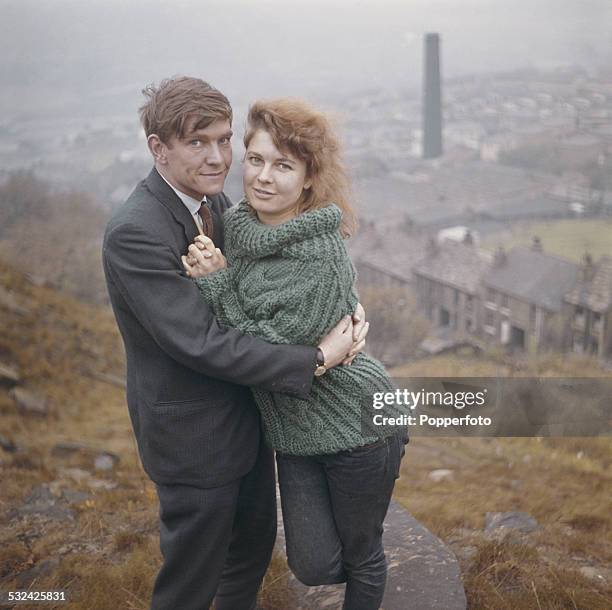 English actor Tom Courtenay pictured with actress Topsy Jane on the hills above Bradford in Yorkshire in 1962. Tom Courtenay is filming 'Billy Liar'...