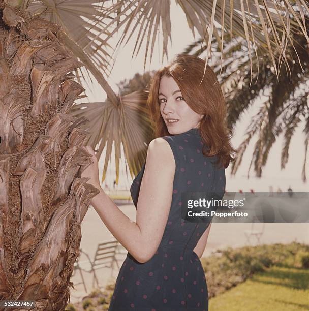 English former model, showgirl and key figure in the Profumo scandal, Christine Keeler posed wearing a blue spotty dress in Cannes, France in May...