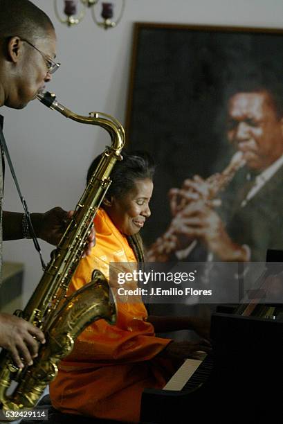 Alice Coltrane plays on the Steinway piano offered by her husband in 1964 and her son Ravi plays the saxophone in front of a photograph of John...