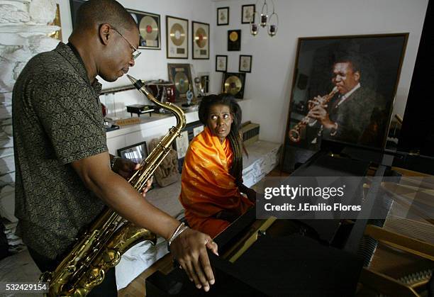 Alice Coltrane plays on the Steinway piano offered by her husband in 1964 and her son Ravi plays the saxophone in front of a photograph of John...