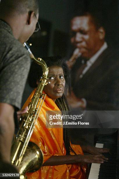 Alice Coltrane plays on the Steinway piano offered by her husband in 1964 and her son Ravi plays the saxophone in front of a photograph of John...