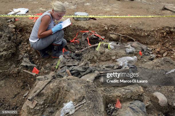 International Commission on Missing Persons forensic archaeologist, Renee Kosalka from Canada provides works on an excavation at the Budak mass grave...