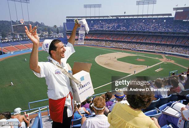 General view of a peanut vendor selling peanuts to fans during a game at Dodger Stadium in Los Angeles, California.