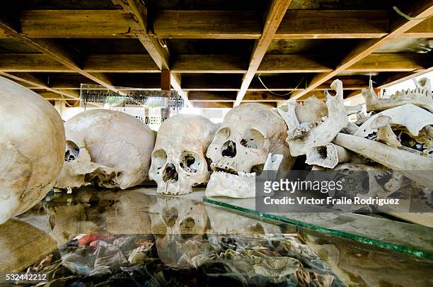 May 2011, Phnom Penh, Cambodia --- A pile of human skulls displayed at the Choeung Ek Genocide Memorial, also know as The Killing Fields, where the...