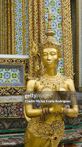 Bangkok, Thailand --- Statue of a kinnara in the Wat Phra Kaew Temple of the Emerald Buddha in Bangkok. Photo by Victor Fraile --- Image by © Victor...