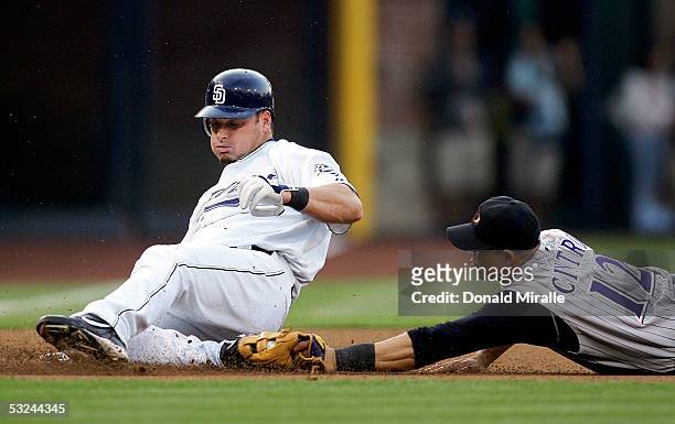 Mark Sweeney of the San Diego Padres is tagged out by third Baseman Alex Cintron of the Arizona Diamondbacks as Sweeney attempts to steal third on an...