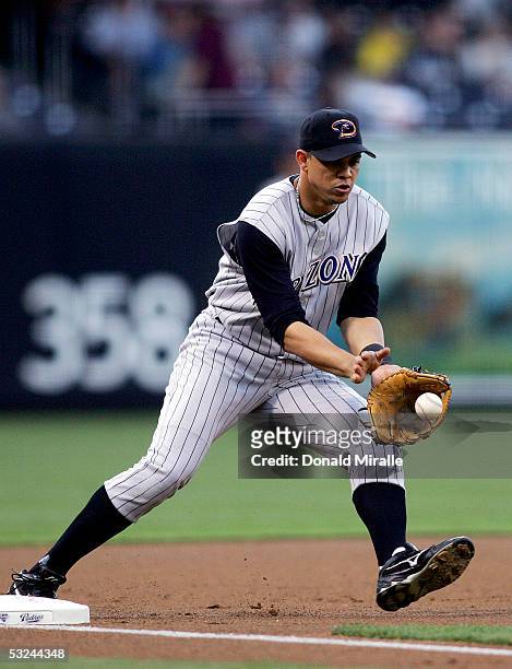 Third baseman Alex Cintron of the Arizona Diamondbacks grabs a ground ball to make the second out of the third inning against the San Diego Padres...