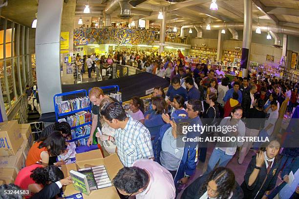 Hundreds of purchasers queue up for the new Harry Potter book, "Harry Potter and the Half Blood Prince", by author J. K. Rowling, at a bookshop in...