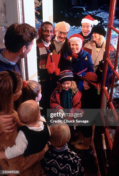 christmas carolers - christmas music listen stock pictures, royalty-free photos & images