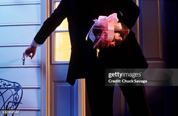 prom date ringing doorbell holding corsage and keys - prom stock pictures, royalty-free photos & images