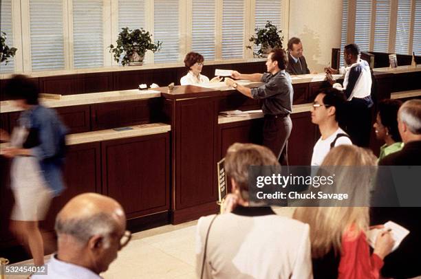 people on bank line - inside of bank stock pictures, royalty-free photos & images