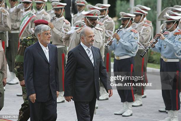 Iraqi Prime Minister Ibrahim Jaafari and Iranian Vice-President Mohammad Reza Aref review the honor guard during an official welcoming ceremony for...