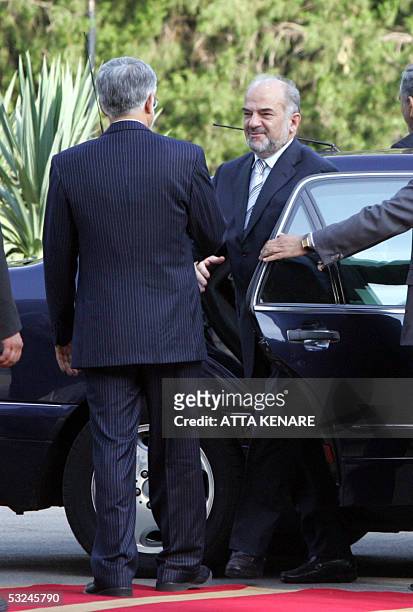 Iranian Vice-President Mohammad Reza Aref welcomes visiting Iraqi Prime Minister Ibrahim Jaafari at the Saadabad palace in Tehran 16 July 2005....
