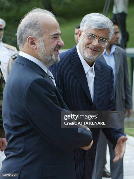 Iranian Vice-President Mohammad Reza Aref shakes hands with visiting Iraqi Prime Minister Ibrahim al-Jaafari during an official welcoming ceremony...