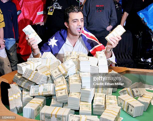 Australian Joseph Hachem poses with some of the $7.5 million he won on the final day of competition at the World Series of Poker no-limit Texas Hold...
