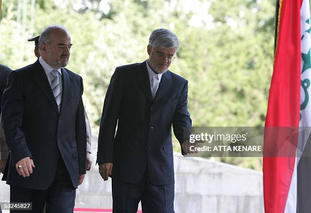 Iranian Vice-President Mohammad Reza Aref welcomes visiting Iraqi Prime Minister Ibrahim Jaafari at the Saadabad palace in Tehran 16 July 2005....