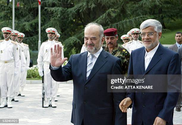 Iranian Vice-President Mohammad Reza Aref welcomes visiting Iraqi Prime Minister Ibrahim Jaafari at the Saadabad palace in Tehran 16 July 2005....