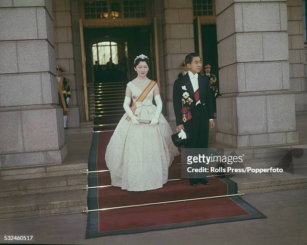 Crown Prince Akihito and his bride Michiko Shoda leave the Imperial Palace after their wedding ceremony in Tokyo, Japan on 10th April 1959.